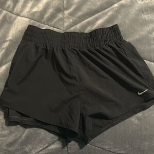 Black Nike running shorts with spandex attached. Size M. Like new condition